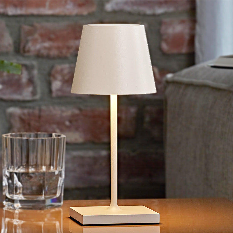 Cordless table lamp with aluminum body and touch controls, suitable for outdoor and bathroom use