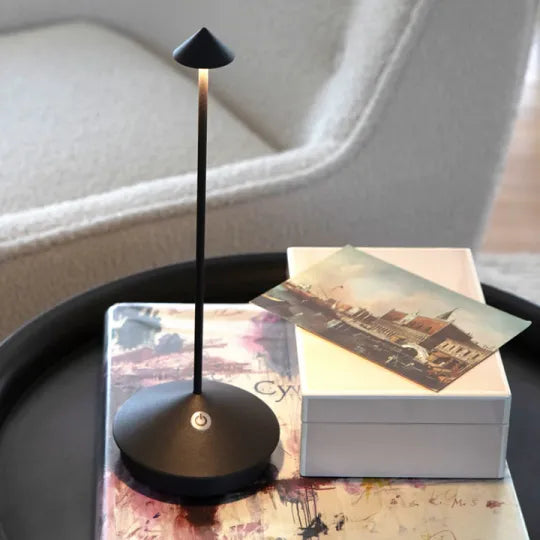Cordless LED table lamp on a patio table for outdoor ambiance