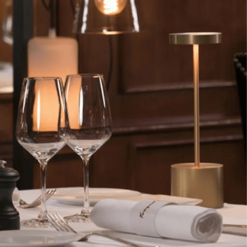 Cordless table lamp with warm light on an outdoor dining table