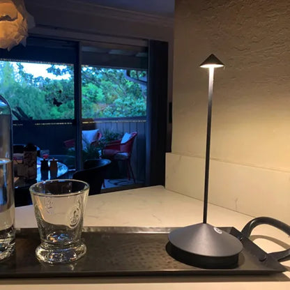 Cordless LED table lamp on a patio table for outdoor ambiance