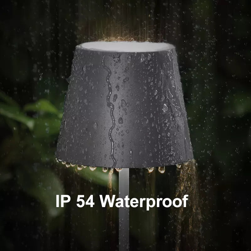 Cordless waterproof table lamp on an outdoor dining table for patio use