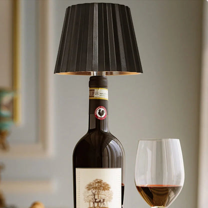 Rechargeable wine bottle light with color-changing LED on a black bottle for home entertaining