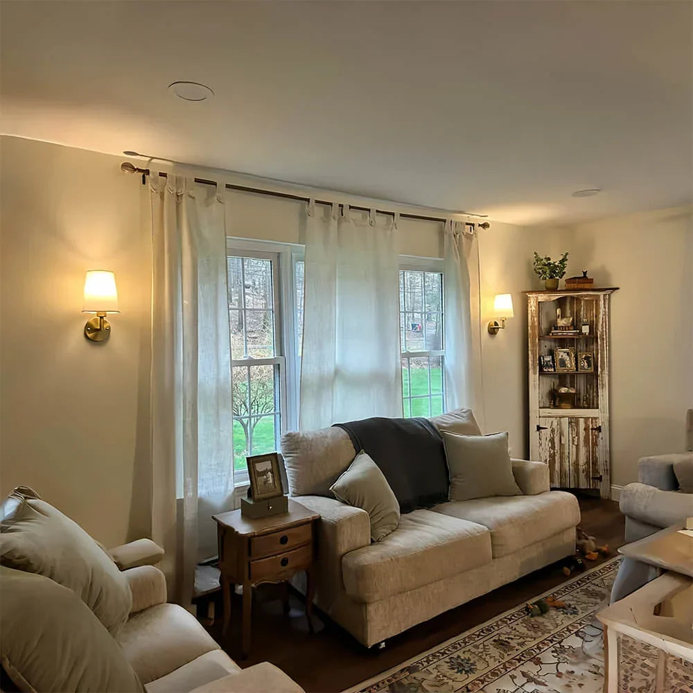 Cordless fabric wall sconce with metal accents for renters