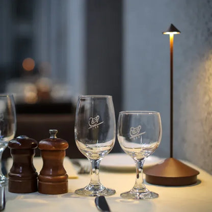 Cordless LED table lamp on a patio table for outdoor ambiance