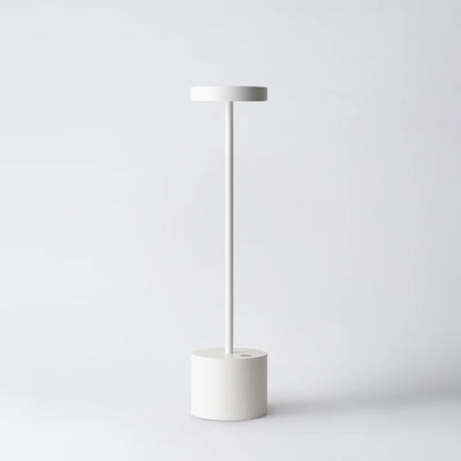 Cordless table lamp with warm light on an outdoor dining table