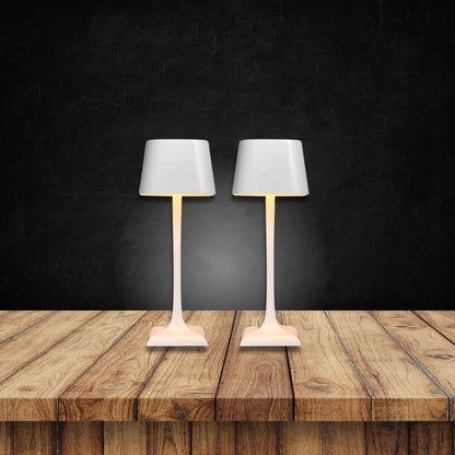 Cordless table lamp with touch controls on a bedside table, portable for any room