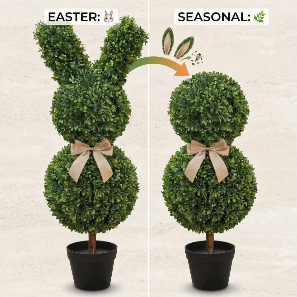 Set of two 36-inch artificial Easter bunny topiaries with green foliage and champagne bows on a porch