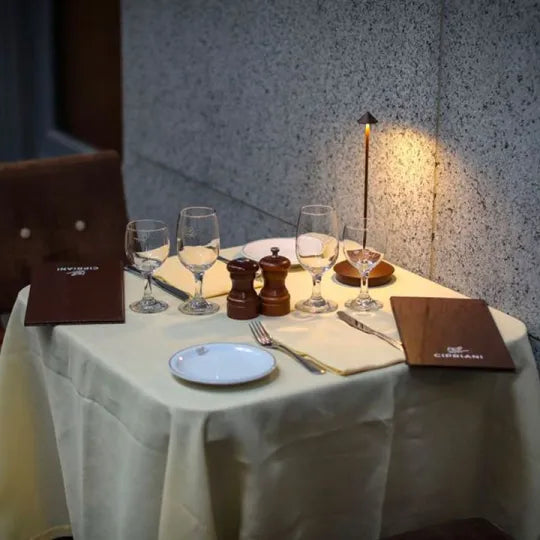 Cordless LED table lamp on a patio table for outdoor ambiance