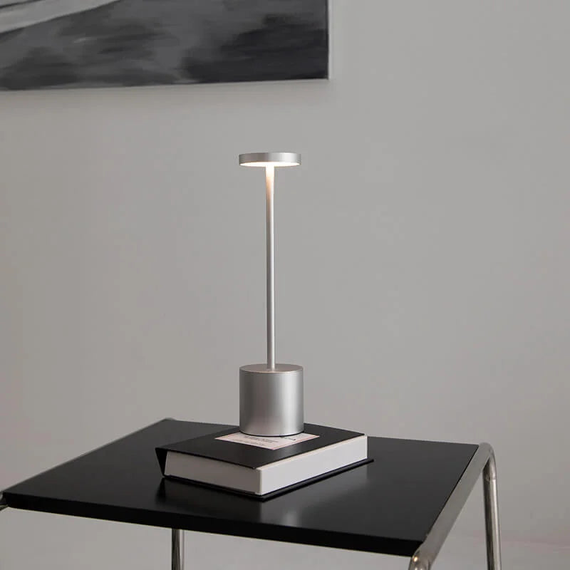 Cordless table lamp with warm light on an outdoor dining table