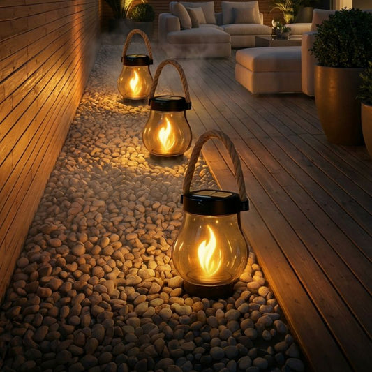 Solar-powered outdoor lantern with flickering flame effect on a patio table