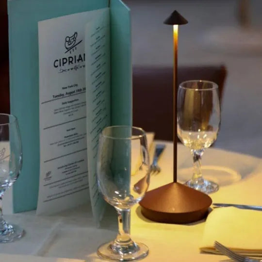 Cordless LED table lamp on a patio table for outdoor ambiance