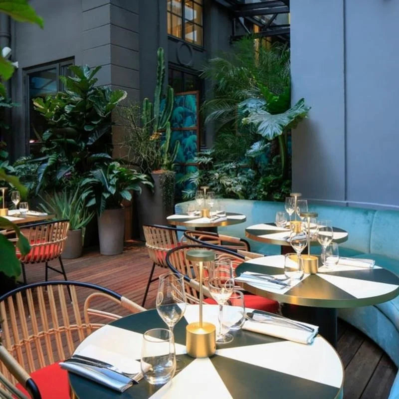 Cordless table lamp with warm light on an outdoor dining table