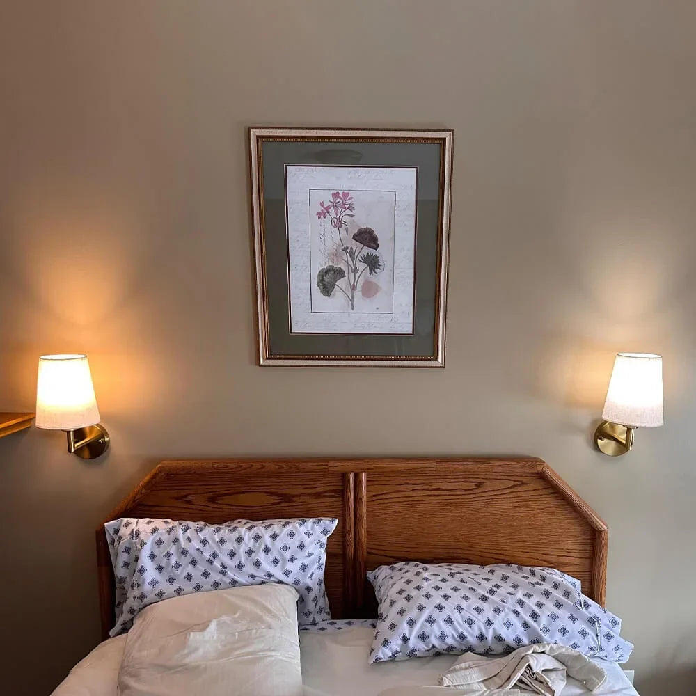 Cordless fabric wall sconce with metal accents for renters