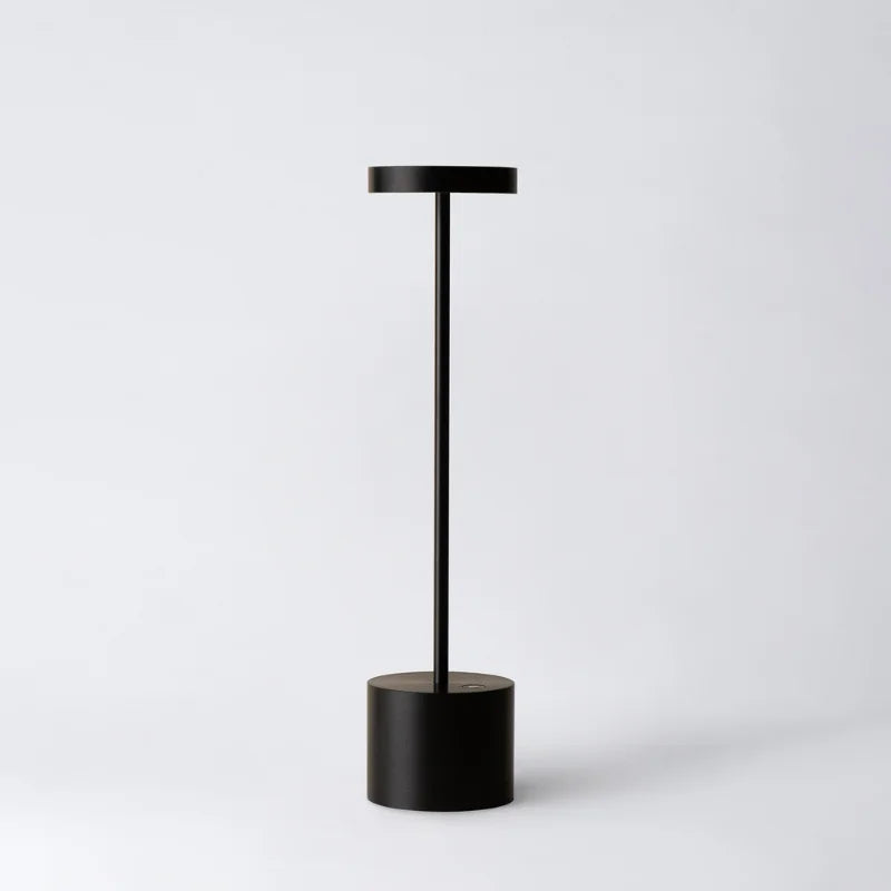 Cordless table lamp with warm light on an outdoor dining table
