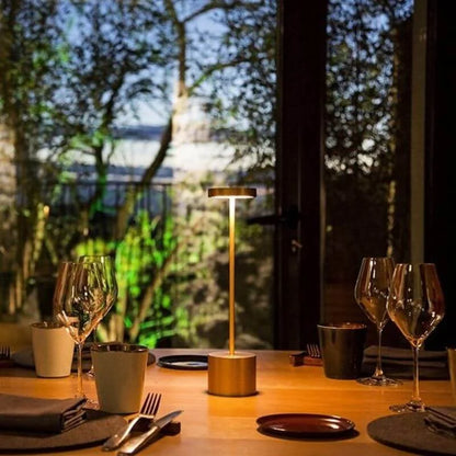 Cordless table lamp with warm light on an outdoor dining table