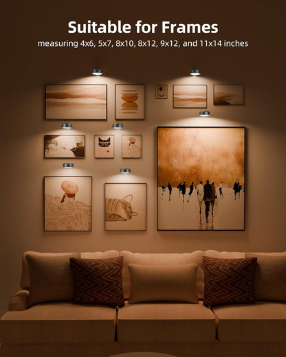 Wireless rechargeable picture light illuminating a framed photo on a wall