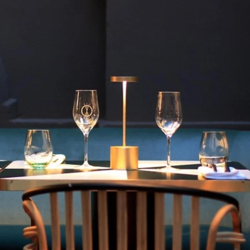 Cordless table lamp with warm light on an outdoor dining table