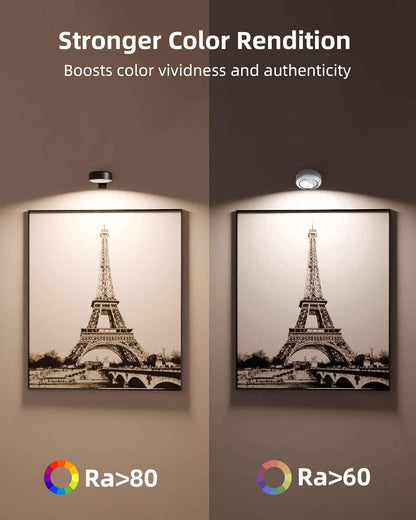 Wireless rechargeable picture light illuminating a framed photo on a wall