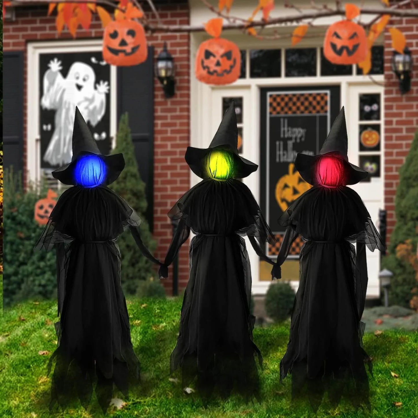 Life-size sound-activated screaming Halloween witches with glowing LED faces for yard display