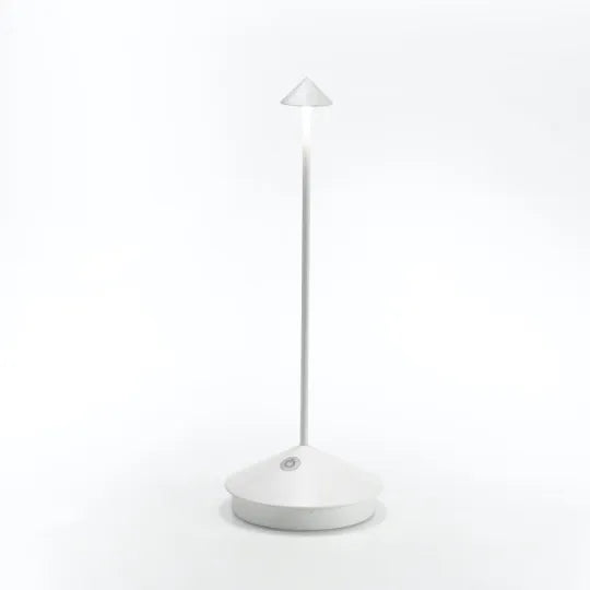 Cordless LED table lamp on a patio table for outdoor ambiance