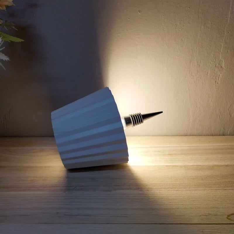 Rechargeable wine bottle light with color-changing LED on a black bottle for home entertaining