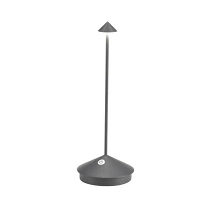 Cordless LED table lamp on a patio table for outdoor ambiance