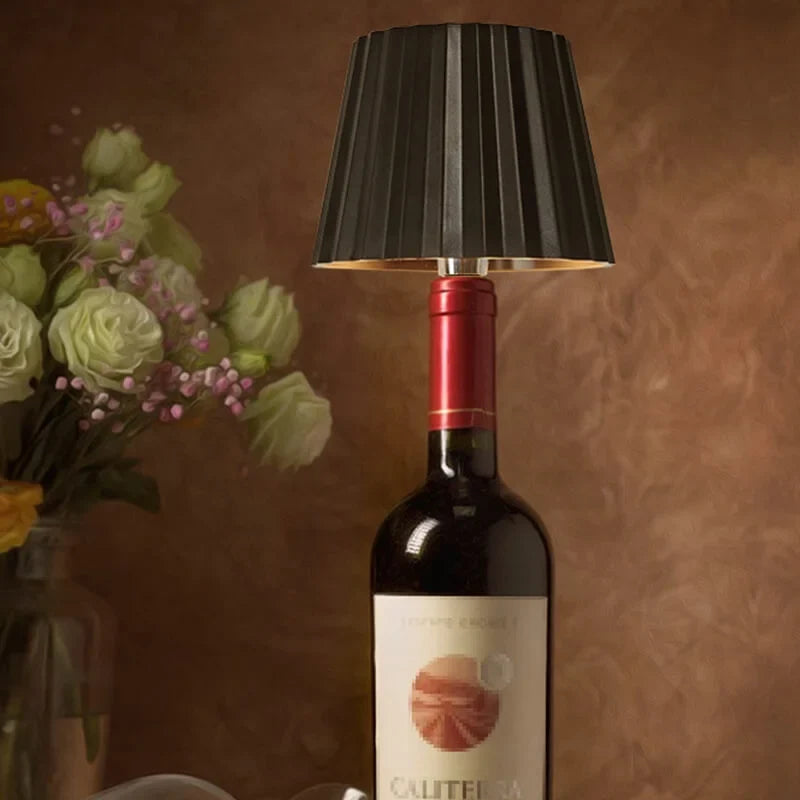 Rechargeable wine bottle light with color-changing LED on a black bottle for home entertaining