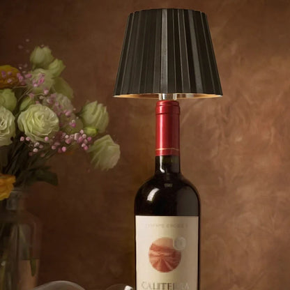 Rechargeable wine bottle light with color-changing LED on a black bottle for home entertaining