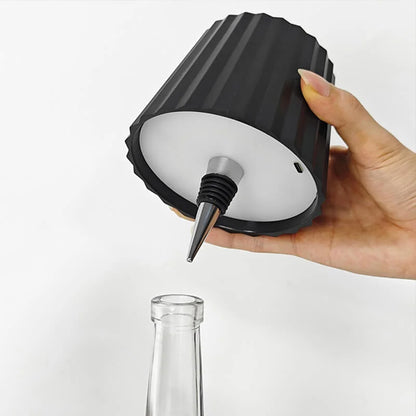 Rechargeable wine bottle light with color-changing LED on a black bottle for home entertaining
