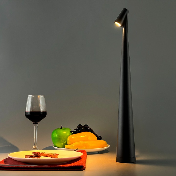 Cordless reading lamp with downward shade on a nightstand, ideal for apartment dwellers and students