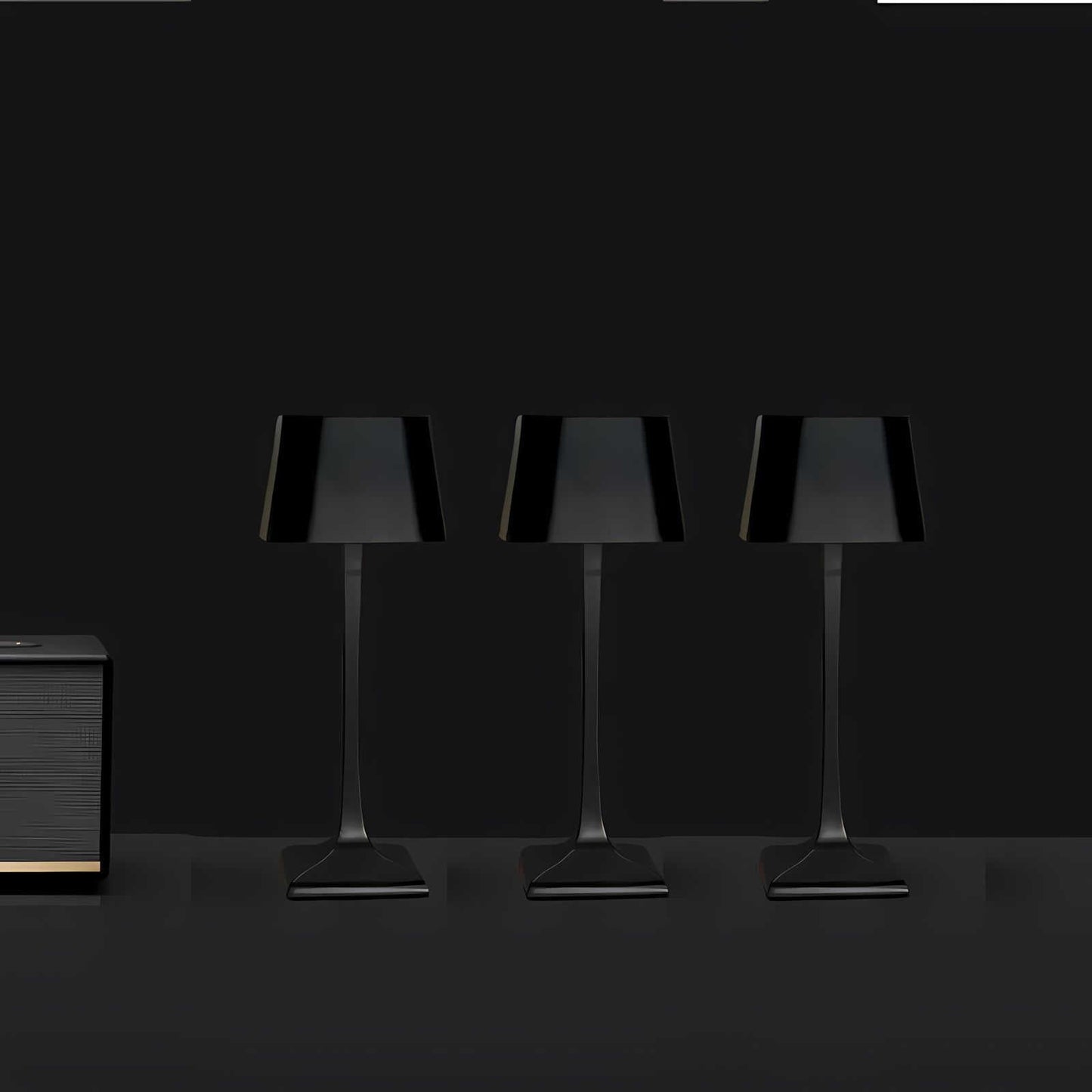 Cordless table lamp with touch controls on a bedside table, portable for any room