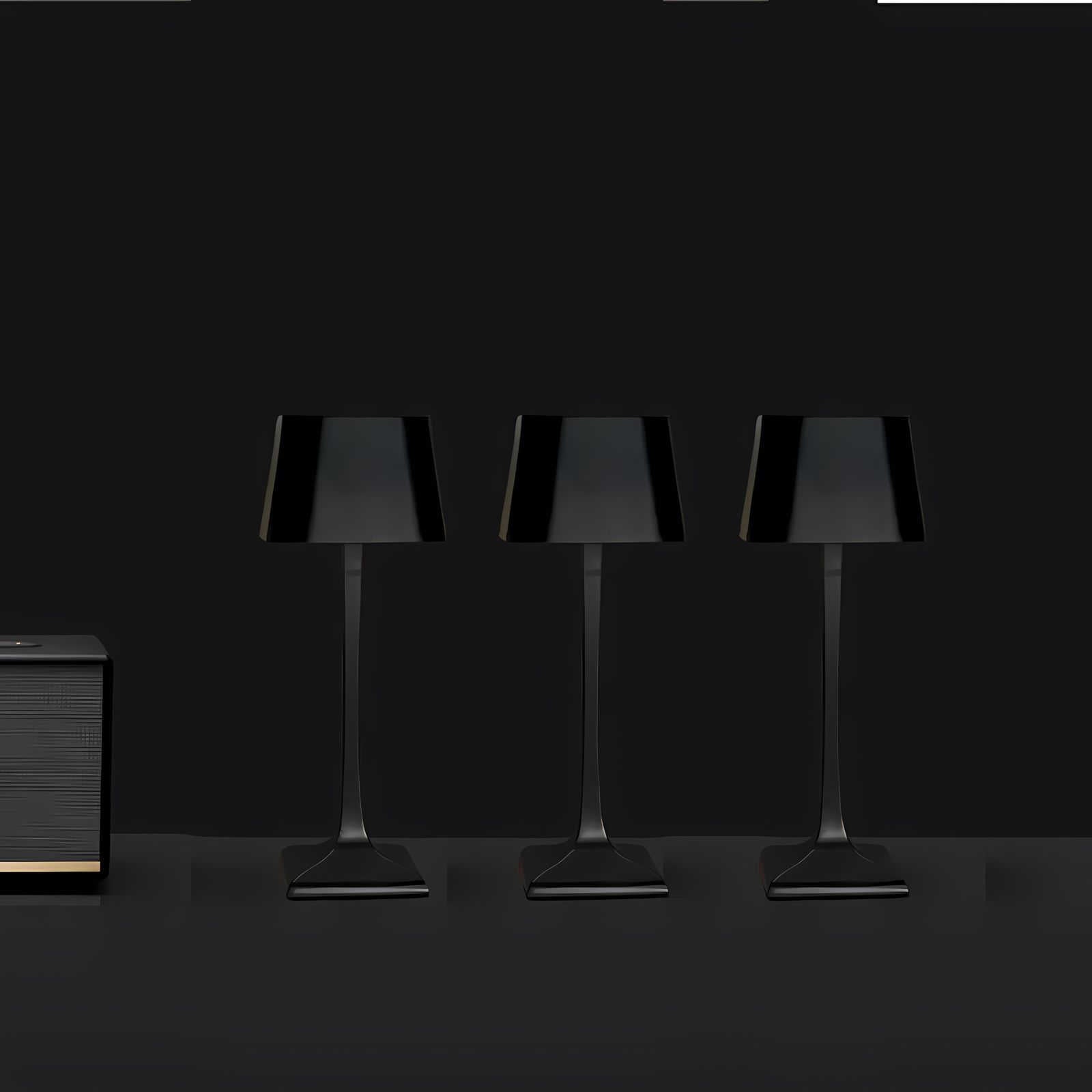 Cordless table lamp with touch controls on a bedside table, portable for any room