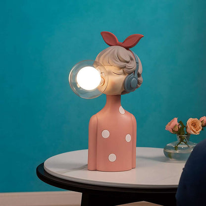 Handcrafted resin cordless table lamp with glass globe for design-conscious decorators
