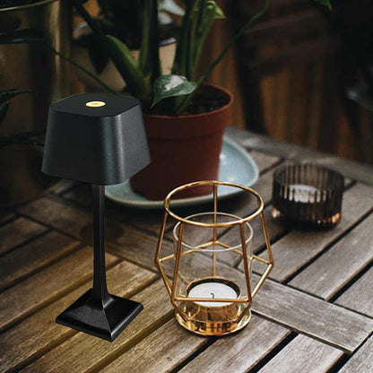 Cordless table lamp with touch controls on a bedside table, portable for any room