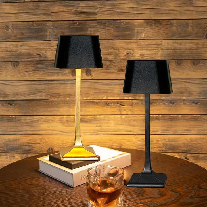 Cordless table lamp with touch controls on a bedside table, portable for any room