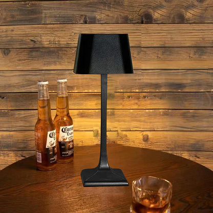 Cordless table lamp with touch controls on a bedside table, portable for any room