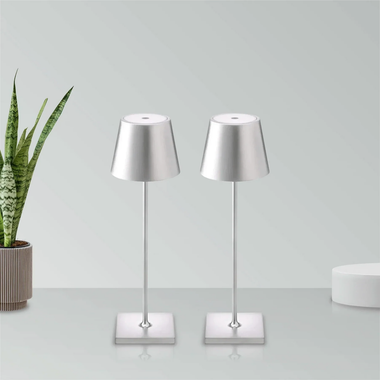 Cordless waterproof table lamp on an outdoor dining table for patio use