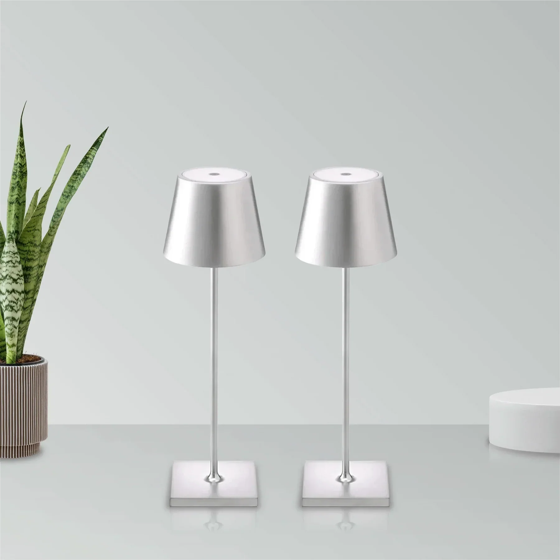 Cordless waterproof table lamp on an outdoor dining table for patio use
