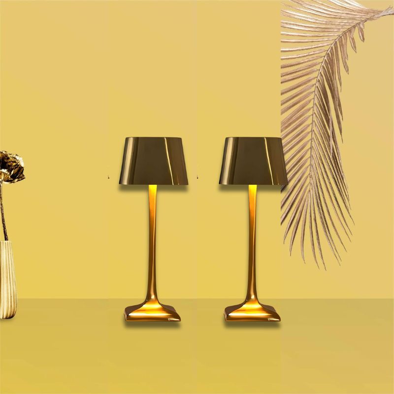 Cordless table lamp with touch controls on a bedside table, portable for any room