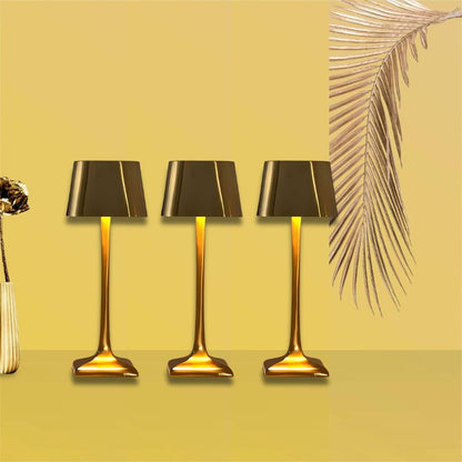 Cordless table lamp with touch controls on a bedside table, portable for any room