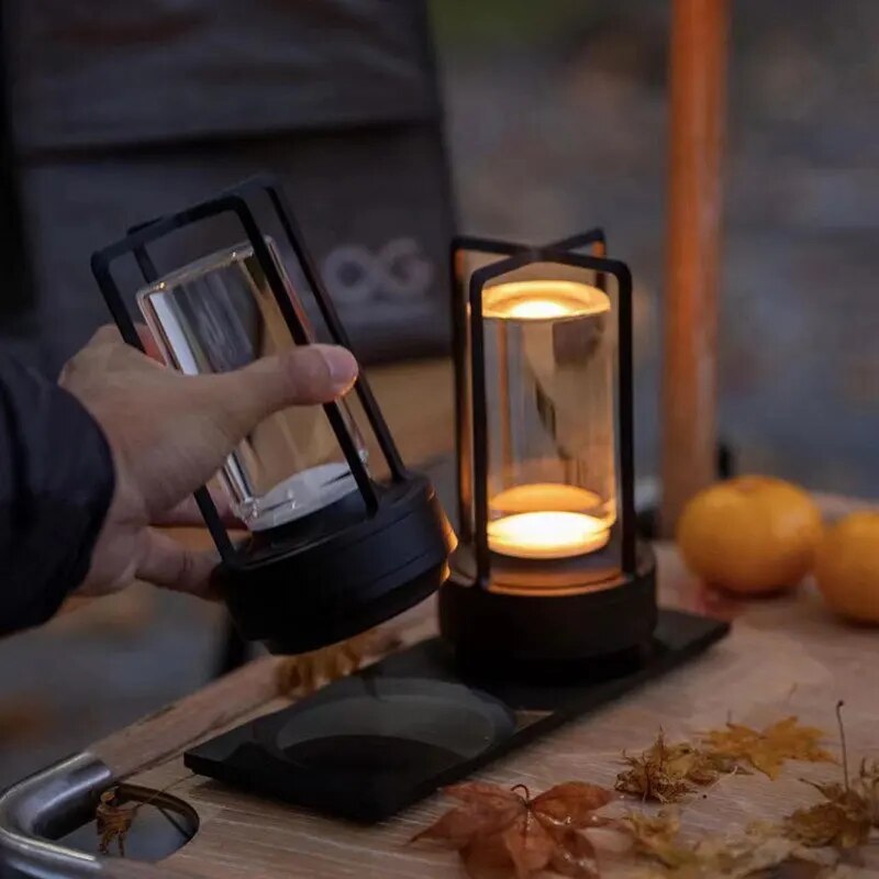 Cordless lantern lamp with adjustable brightness on a patio table for outdoor ambiance