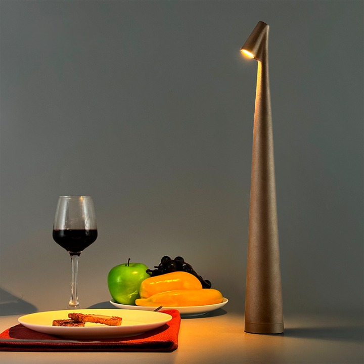 Cordless reading lamp with downward shade on a nightstand, ideal for apartment dwellers and students