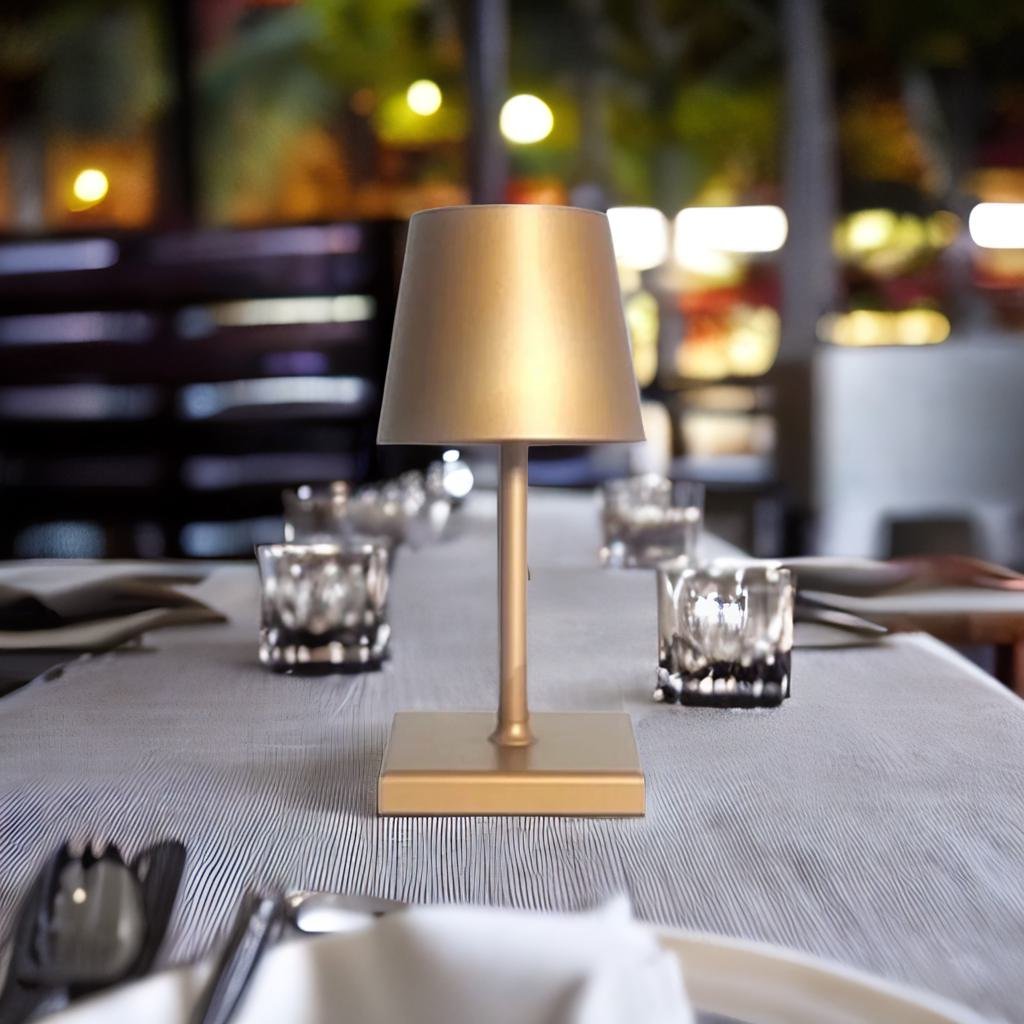 Cordless table lamp with aluminum body and touch controls, suitable for outdoor and bathroom use