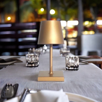 Cordless table lamp with aluminum body and touch controls, suitable for outdoor and bathroom use