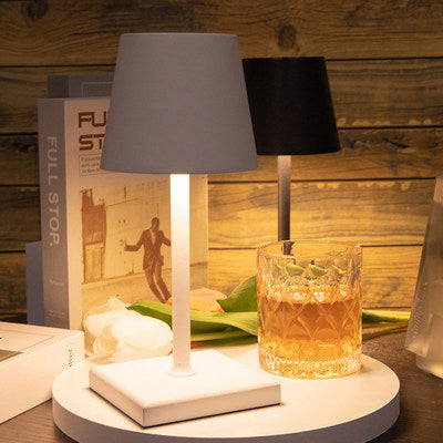 Cordless table lamp with aluminum body and touch controls, suitable for outdoor and bathroom use