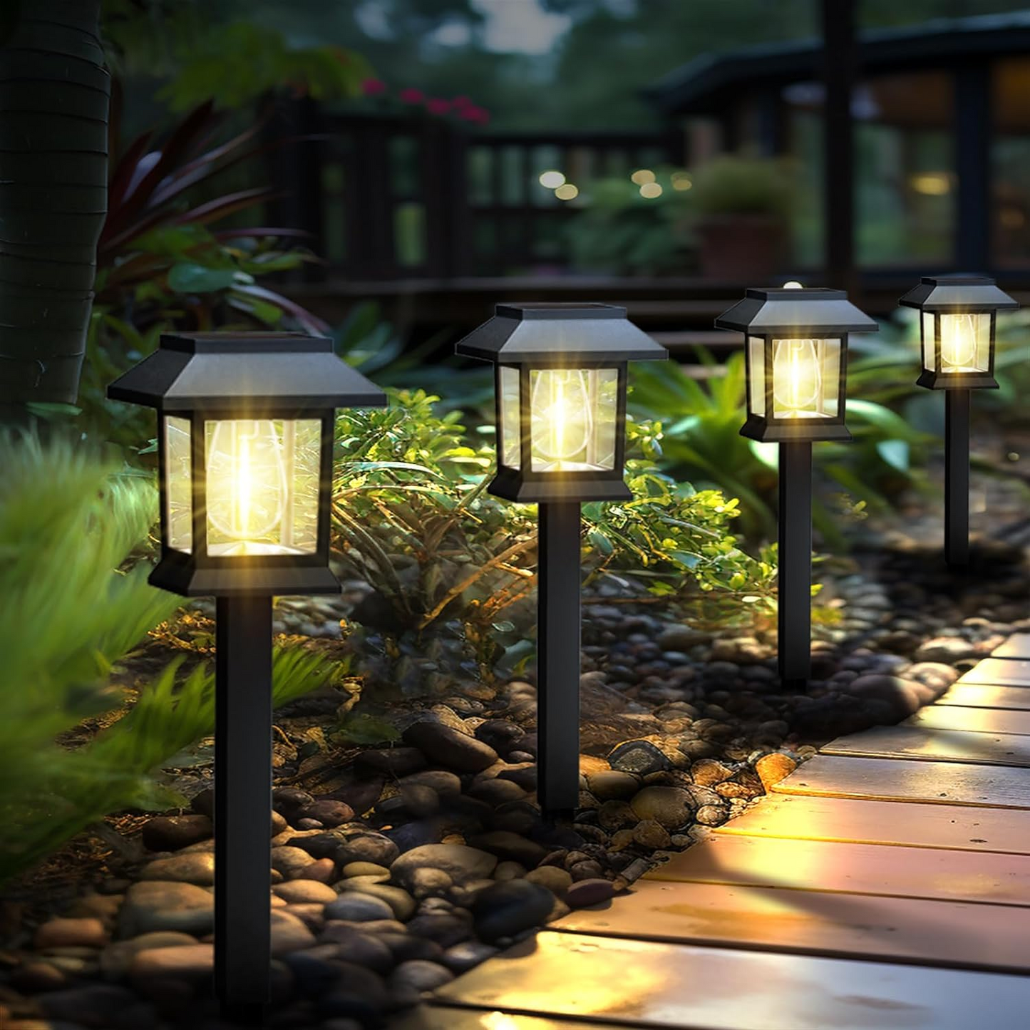 Edison-style solar lawn lights glowing along a garden path at dusk