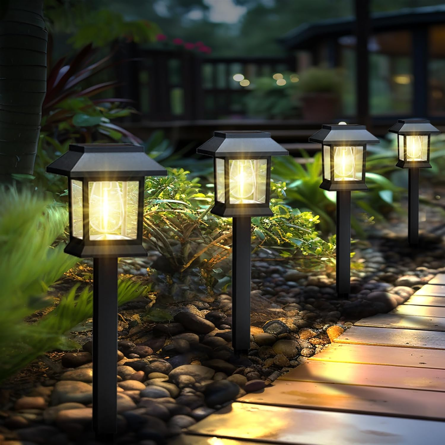 Edison-style solar lawn lights glowing along a garden path at dusk
