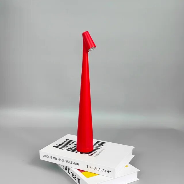Cordless reading lamp with downward shade on a nightstand, ideal for apartment dwellers and students