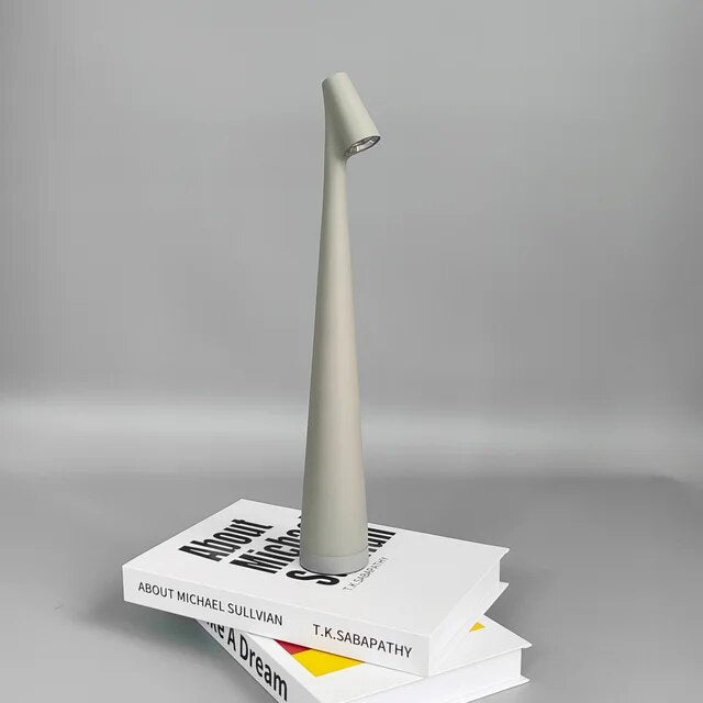 Cordless touch lamp with aluminum body and downward shade, perfect for apartment dwellers