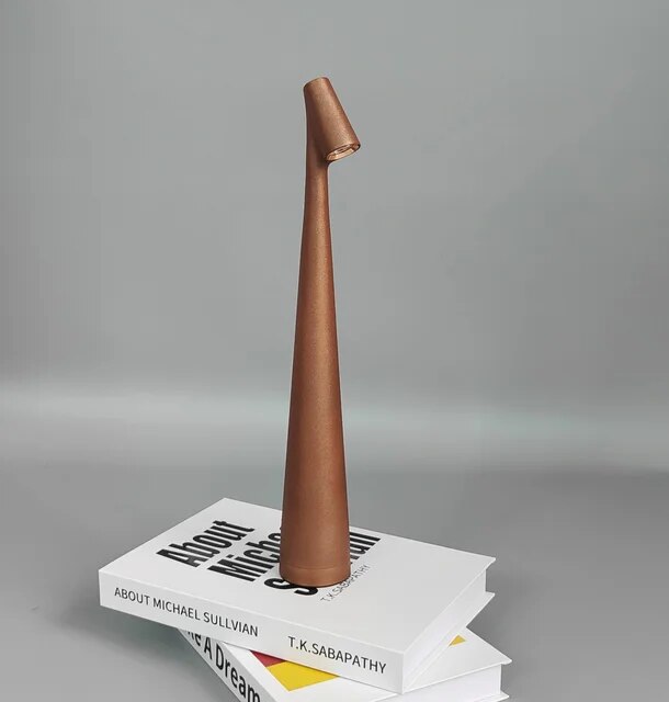 Cordless reading lamp with downward shade on a nightstand, ideal for apartment dwellers and students